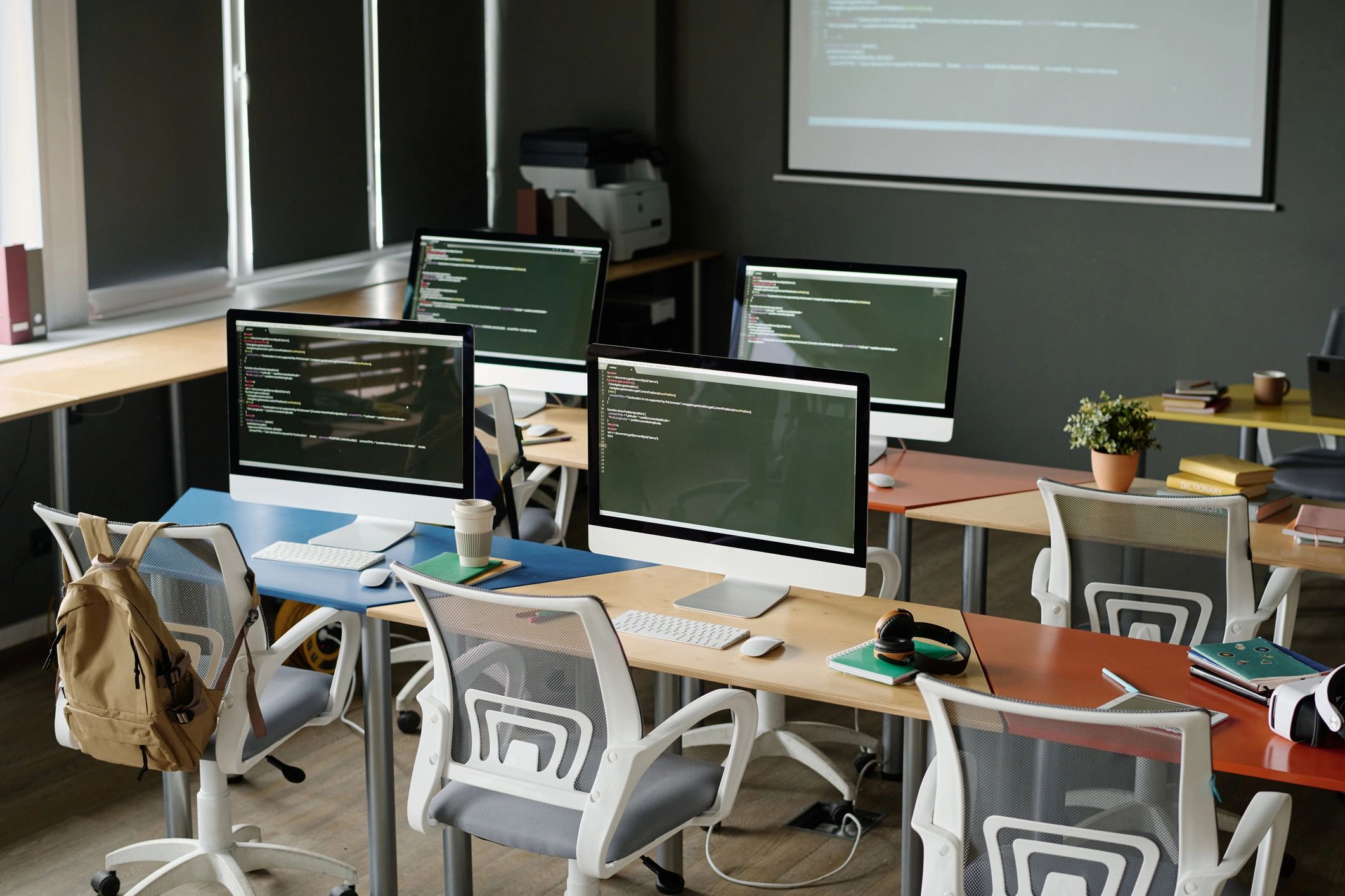 Modern IT workspace with computers and digital systems